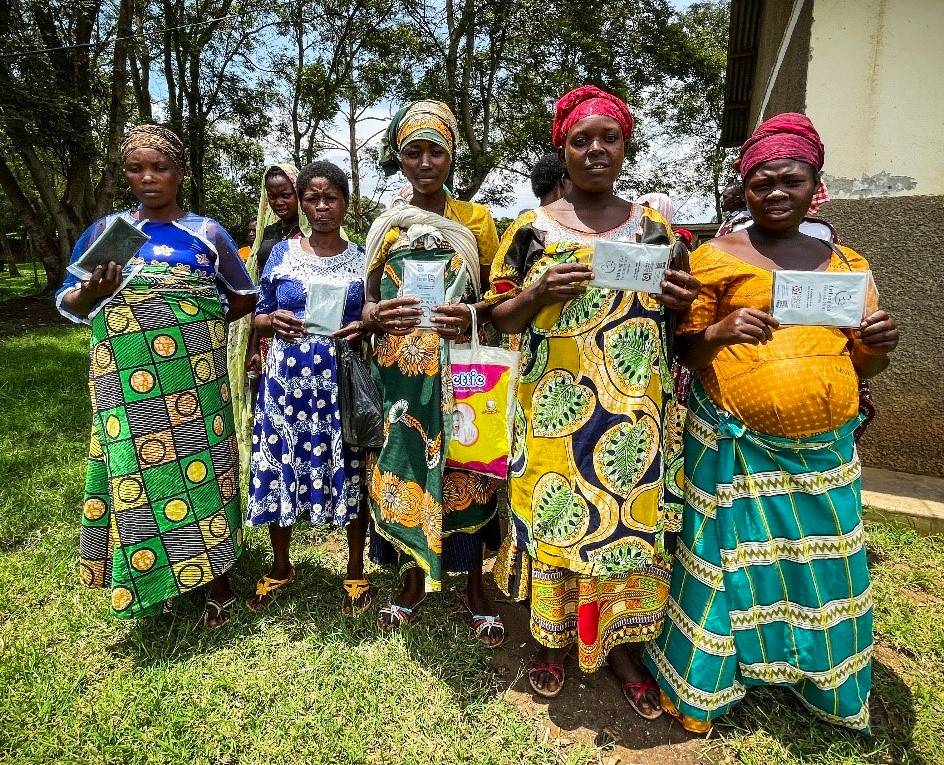 Pregnant women in a remote African community hold their Clean Birth Kits