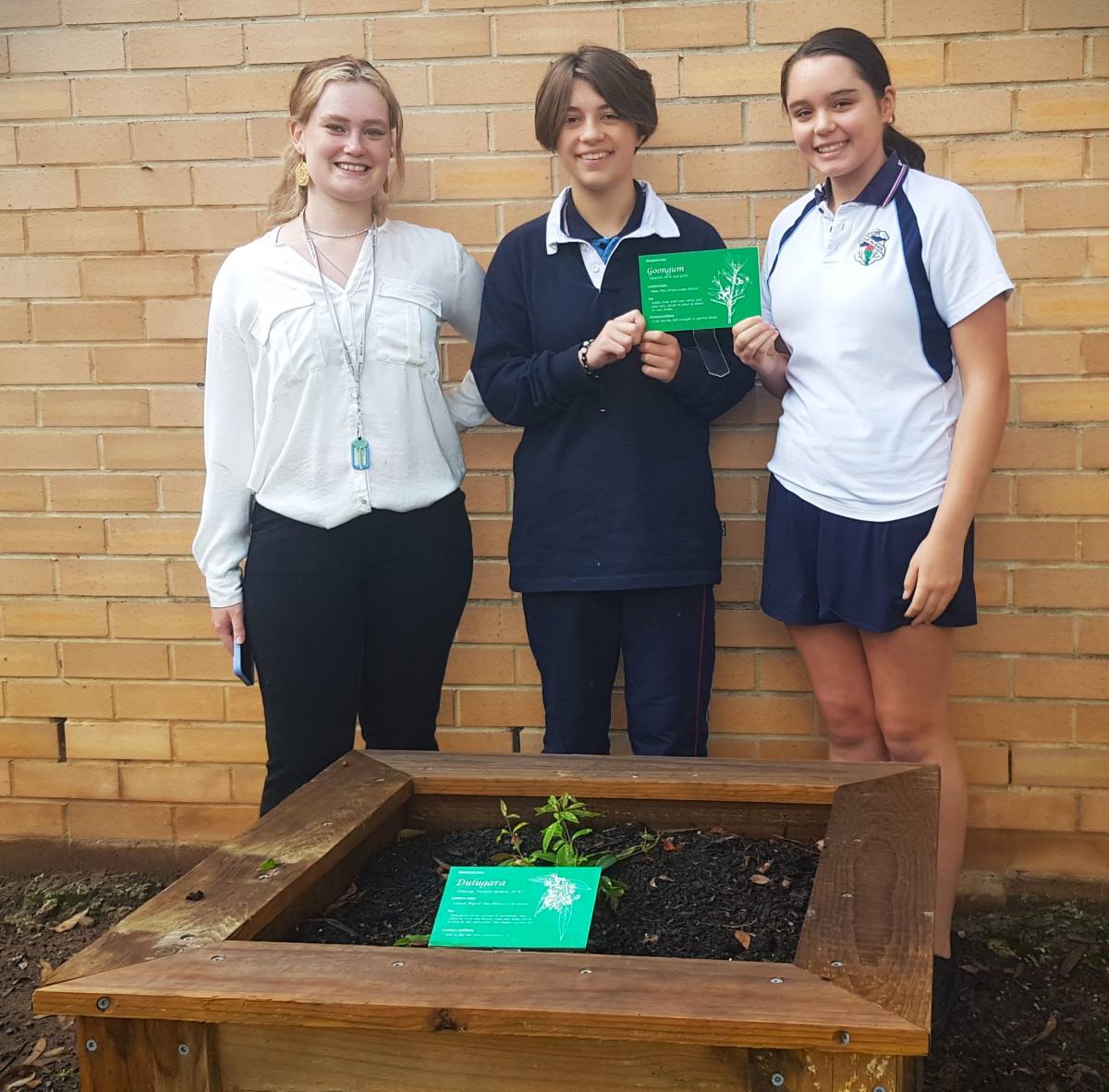 Western Sydney University student and native garden consultant Anastasia Vickers (left) with Blaxland High School students 