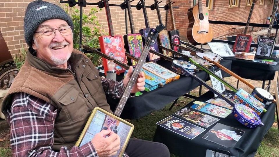 Ken Watts makes innovative guitars from recycled wood, old tins and metal signs.