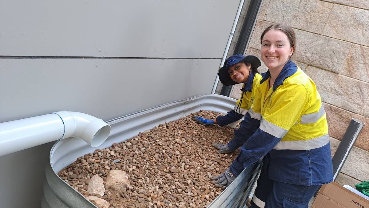 Sydney Water, represented by Graduate Environmental Scientists Lauren and Shreya, partnered with BMCC to help make the rain gardens a reality.