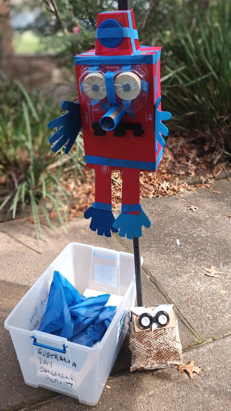 robot and owl made out of trash